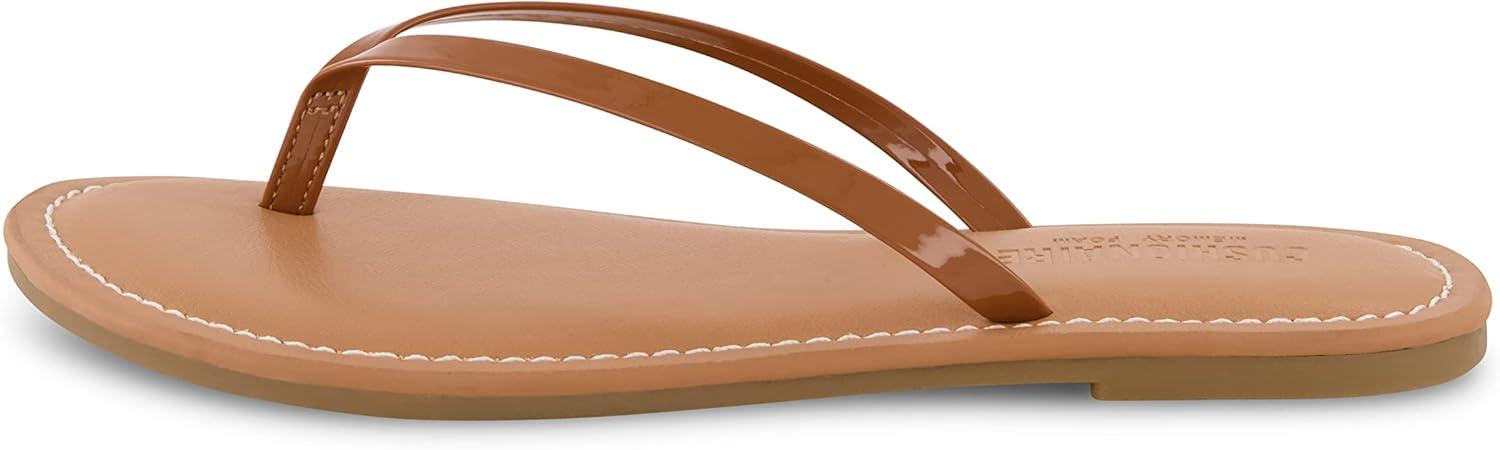 imageCUSHIONAIRE Womens Cora Flat Flip Flop Sandal with ComfortCognac Patent