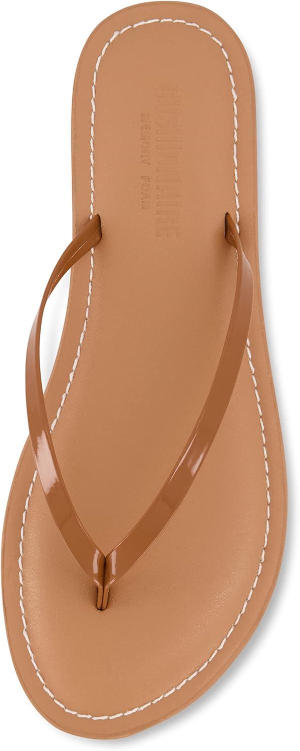 imageCUSHIONAIRE Womens Cora Flat Flip Flop Sandal with ComfortCognac Patent
