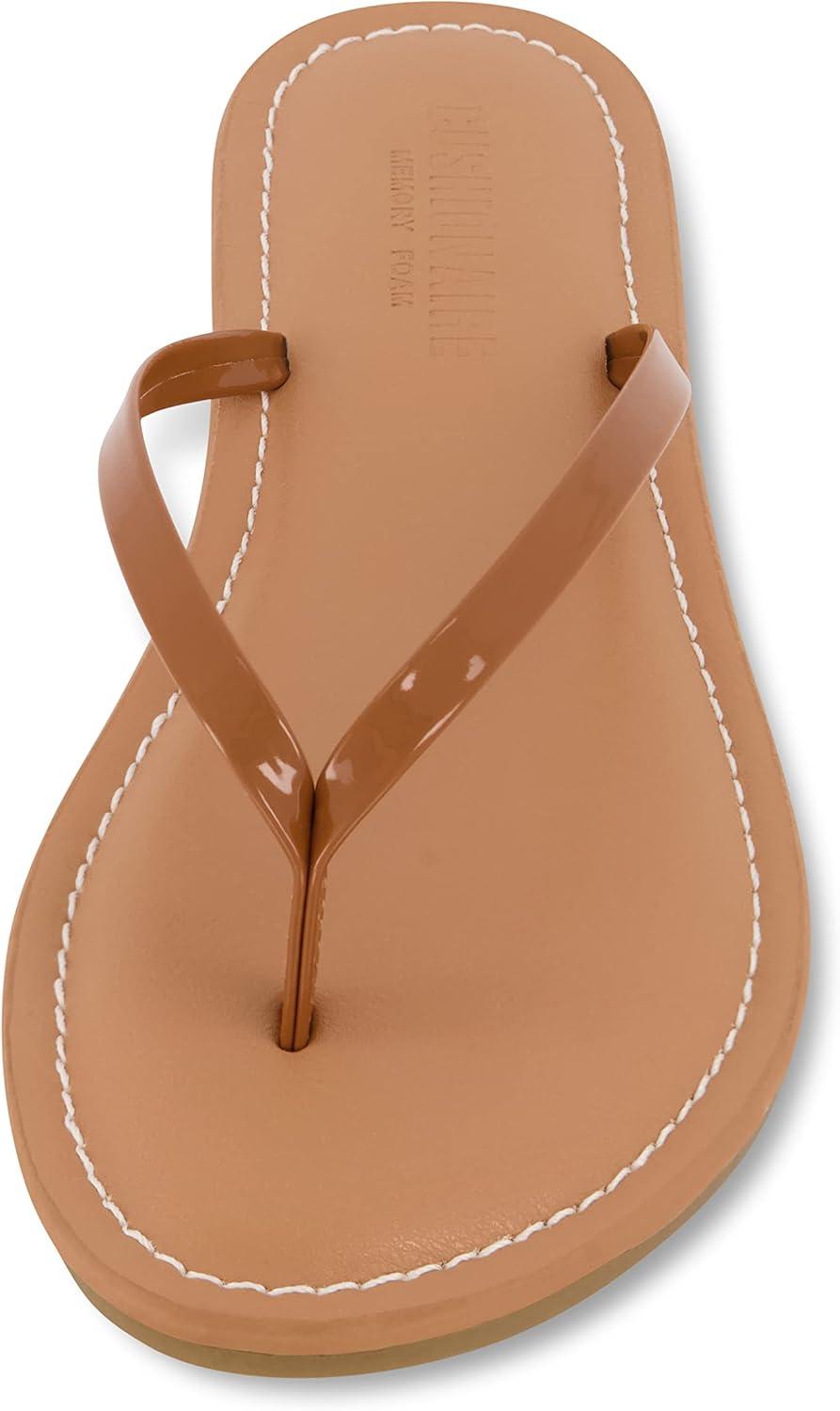 imageCUSHIONAIRE Womens Cora Flat Flip Flop Sandal with ComfortCognac Patent
